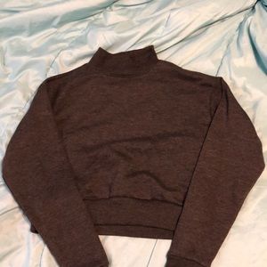 A cropped gray sweater